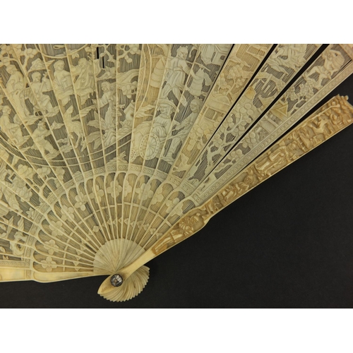 450 - Well detailed Chinese Cantonese ivory fan, profusely pierced and carved with figures, pagodas and fo... 