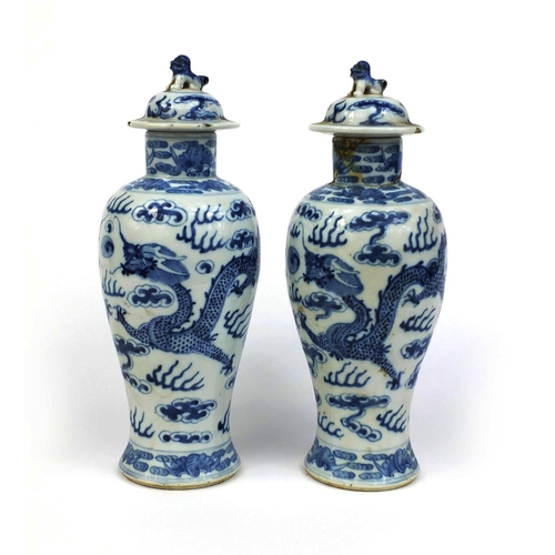 395 - Pair of Chinese blue and white porcelain baluster vases and covers, each hand painted with dragons c... 