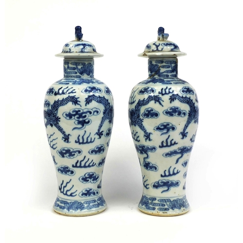 395 - Pair of Chinese blue and white porcelain baluster vases and covers, each hand painted with dragons c... 