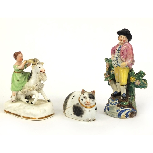 540 - 19th Century Staffordshire model of a girl on a goat, Pearlware figure of a shepherd and a porcelain... 