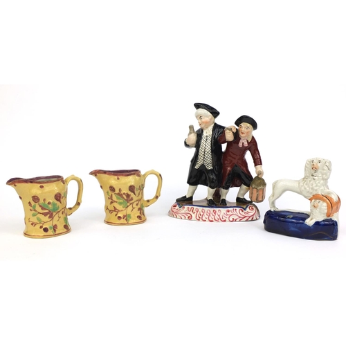 534 - 19th Century Staffordshire pottery spaniel inkwell, drunken figure group and a pair of leaf and berr... 