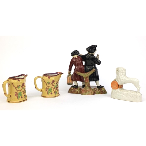 534 - 19th Century Staffordshire pottery spaniel inkwell, drunken figure group and a pair of leaf and berr... 