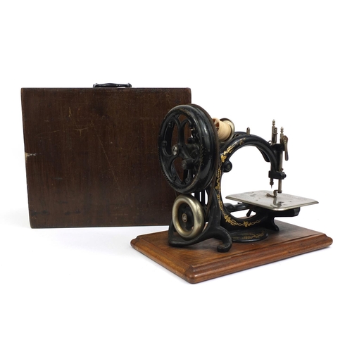 34 - Willcox & Gibbs sewing machine, raised on a plinth base, serial No.A473100, 32cm in length