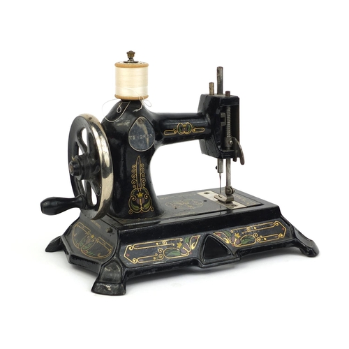 35 - Antique child's mechanical sewing machine, No.2683, 20cm high