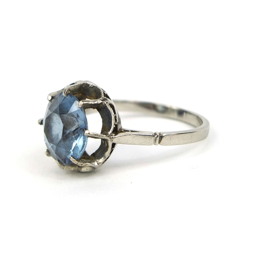 824 - Unmarked platinum blue spinel solitaire ring, size N, approximate weight 4.8g