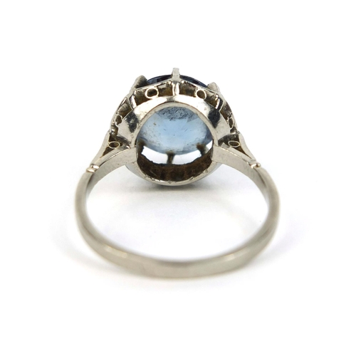 824 - Unmarked platinum blue spinel solitaire ring, size N, approximate weight 4.8g