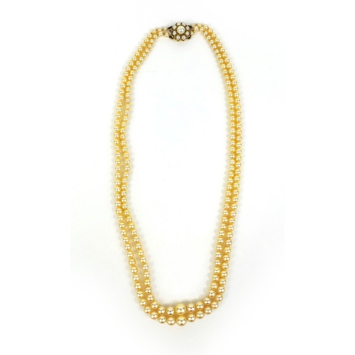 786 - Two row cultured pearl necklace on a 9ct gold clasp, 40cm long, approximate weight 29.6g