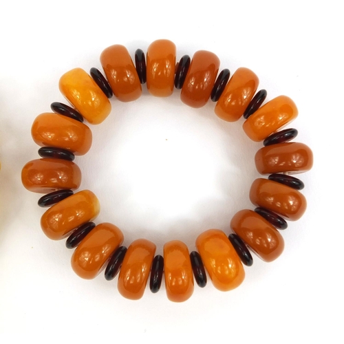 850 - Two Baltic butterscotch amber coloured bead bracelets, approximate weight 76.8g