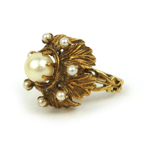 810 - Unmarked gold naturalistic pearl ring set with eight pearls, size L, approximate weight 12.0g