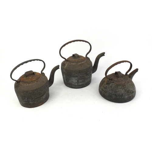 111 - 19th century Holcroft cast iron eight pint kettle, a similar five pint kettle and a four pint kettle