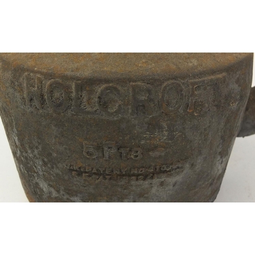 111 - 19th century Holcroft cast iron eight pint kettle, a similar five pint kettle and a four pint kettle