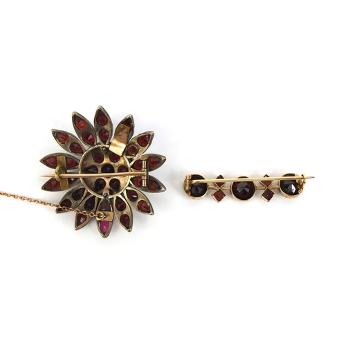 815 - Two gilt metal garnet brooches, the larger 4cm in diameter, approximate weight 11.2g