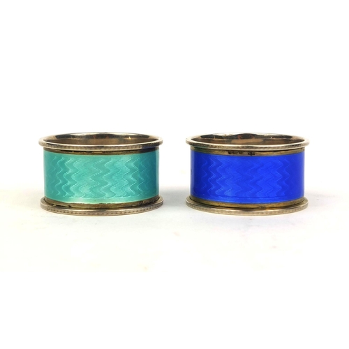 710 - Cased pair of silver guilloche enamelled napkin rings, each stamped 925, 4.5cm in diameter, approxim... 