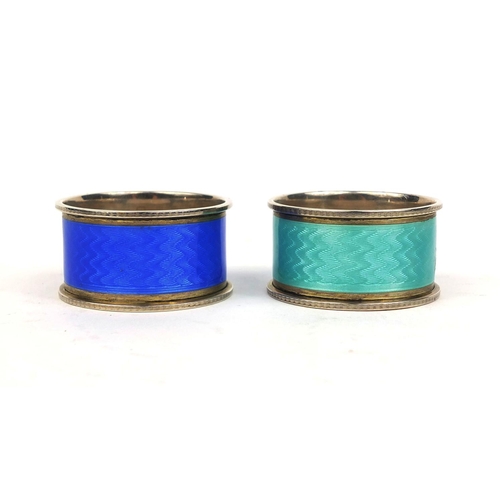 710 - Cased pair of silver guilloche enamelled napkin rings, each stamped 925, 4.5cm in diameter, approxim... 