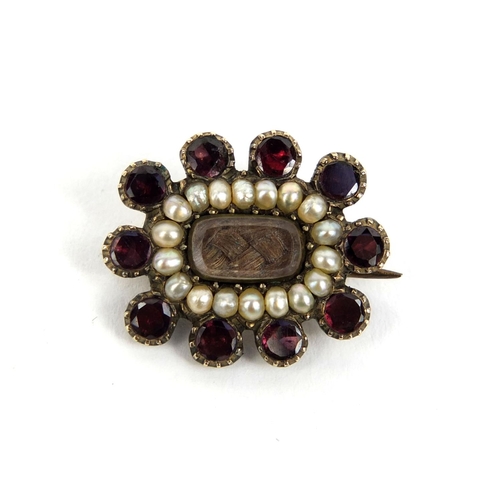 818 - Unmarked gold garnet and seed pearl mourning brooch, approximately 2cm long, approximate weight 2.6g