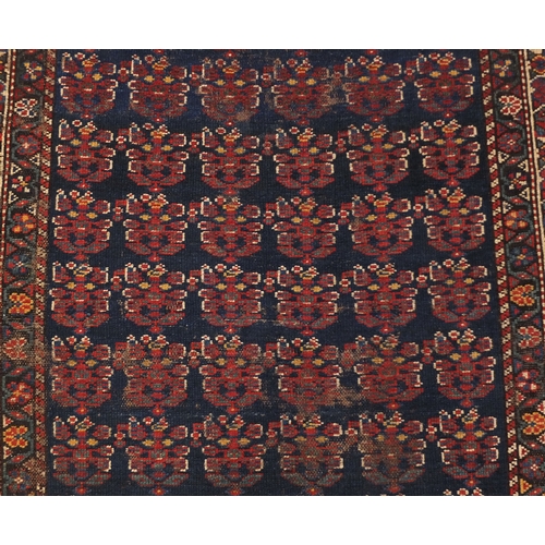 2008 - Rectangular Caucasian carpet runner, the central field having an all over grotesque faces design wit... 