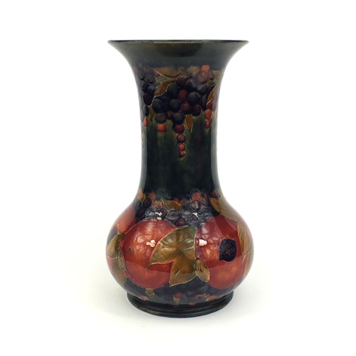 619 - Large William Moorcroft pomegranate pattern pottery vase, with hand painted and tube lined decoratio... 