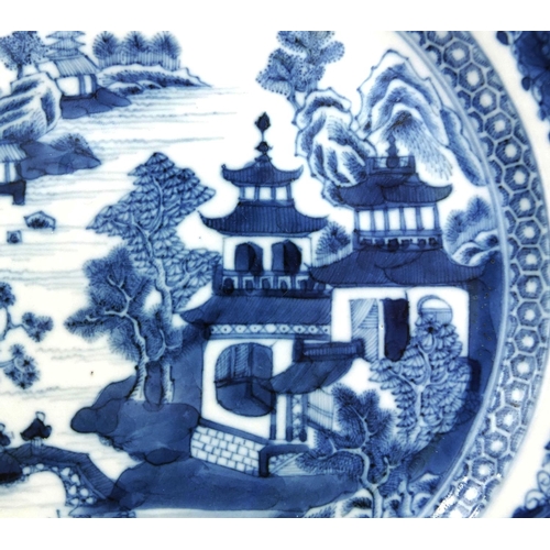 396 - 18th century Chinese blue and white porcelain plate, hand painted with a river landscape within a fo... 