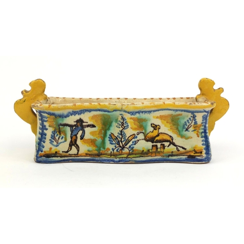 566 - Maiolica pottery twin handled pen tray hand painted with leaping deer's in a landscape, 26cm wide