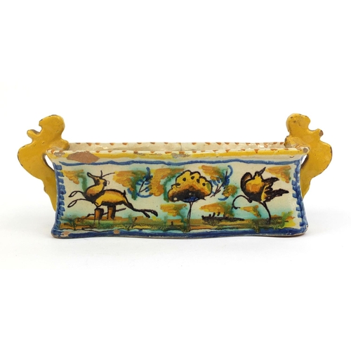 566 - Maiolica pottery twin handled pen tray hand painted with leaping deer's in a landscape, 26cm wide