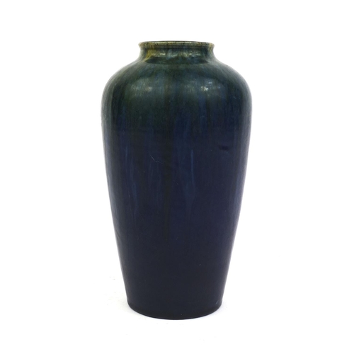 607 - Art pottery vase decorated with a yellow and green running glaze onto a cobalt blue ground, possibly... 