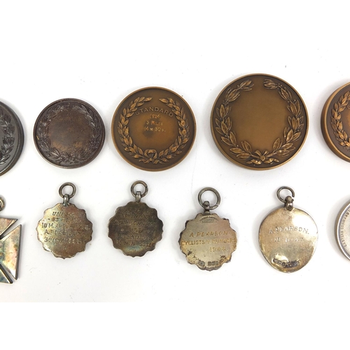 128 - Group of athletic competitors and winners jewels, badges and spoons, including silver examples, rela... 