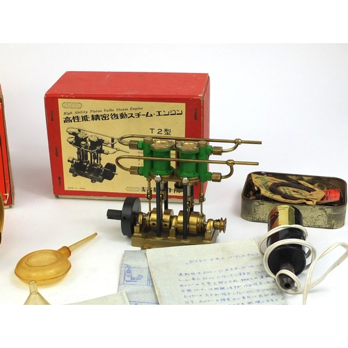 254 - Two boxed Saito steam models, comprising a steam engine and a model marine boiler, together with rel... 