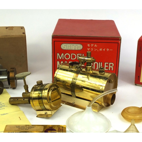 254 - Two boxed Saito steam models, comprising a steam engine and a model marine boiler, together with rel... 