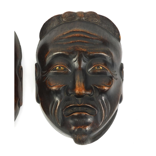 479 - Two Japanese carved wooden noh masks including one of an elder, the largest 14cm high