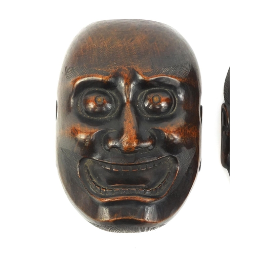 479 - Two Japanese carved wooden noh masks including one of an elder, the largest 14cm high