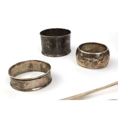 721 - Silver items comprising two large Georgian spoons, Georgian ladle, hip flask, three napkin rings and... 