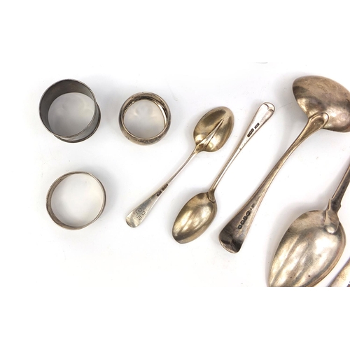 721 - Silver items comprising two large Georgian spoons, Georgian ladle, hip flask, three napkin rings and... 