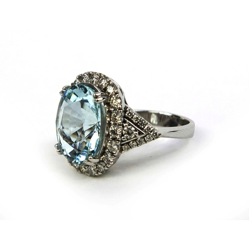 774 - 18ct white gold aquamarine and diamond ring set with a single aquamarine and forty diamonds, size N,... 