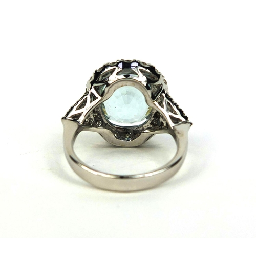 774 - 18ct white gold aquamarine and diamond ring set with a single aquamarine and forty diamonds, size N,... 