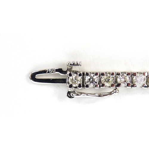 771 - 18ct white gold diamond bracelet set with sixty one diamonds, 18cm long, approximate weight 14.8g