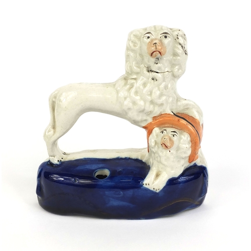 534 - 19th Century Staffordshire pottery spaniel inkwell, drunken figure group and a pair of leaf and berr... 