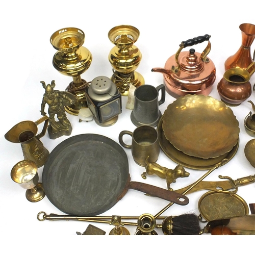 130 - Large selection of brass and copper items including horse brasses, hunting horn, jugs, lanterns, fir... 