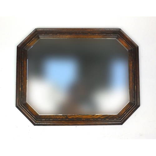 49 - Oak framed bevelled edge wall hanging mirror, 72cm x 56cm