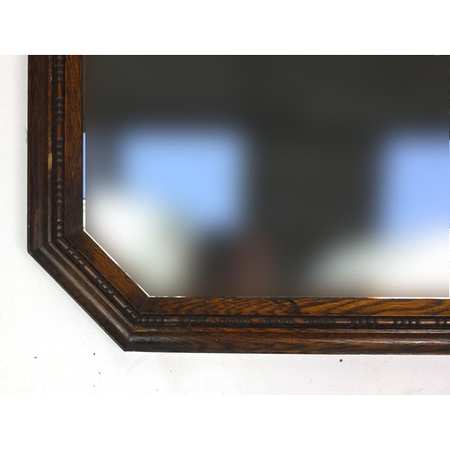 49 - Oak framed bevelled edge wall hanging mirror, 72cm x 56cm