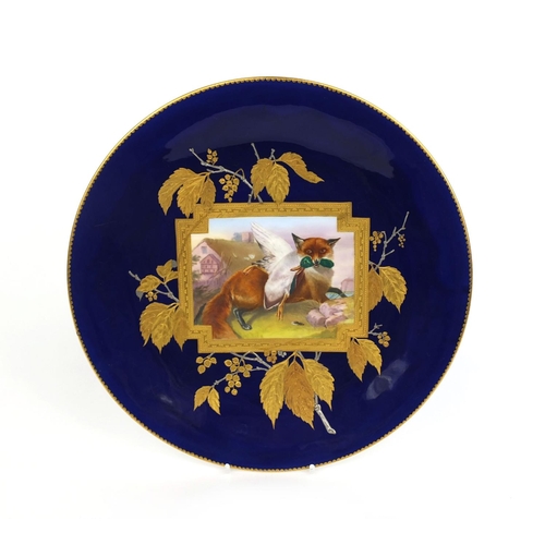 547 - Minton's cabinet plate hand painted with a fox and a duck within gilt foliate boarders onto a cobalt... 