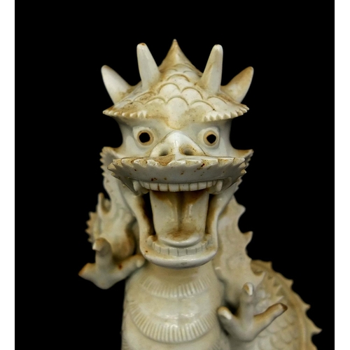 423 - Chinese porcelain Blanc de Chine incense burner in the form of a roaring dragon, paper label to the ... 