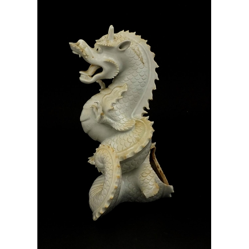 423 - Chinese porcelain Blanc de Chine incense burner in the form of a roaring dragon, paper label to the ... 