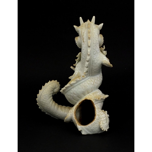 423 - Chinese porcelain Blanc de Chine incense burner in the form of a roaring dragon, paper label to the ... 