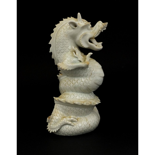 423 - Chinese porcelain Blanc de Chine incense burner in the form of a roaring dragon, paper label to the ... 