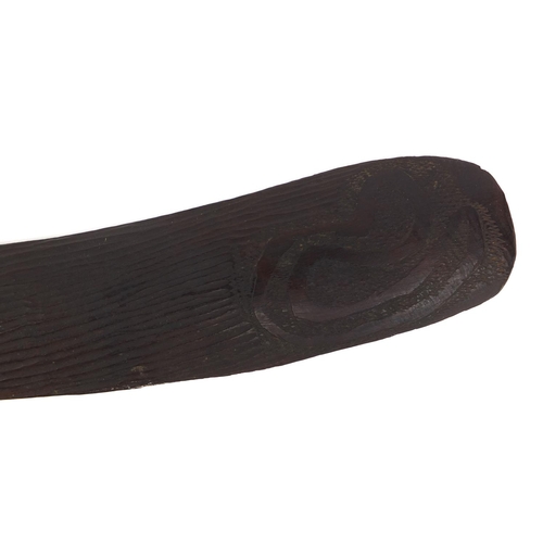 506 - Australian aboriginal interest wooden boomerang with carved decoration, 53cm long