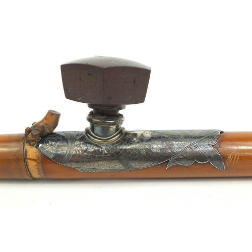 497 - Chinese bamboo opium pipe with ivory end cap and mouth piece, the silver coloured metal mounts in th... 