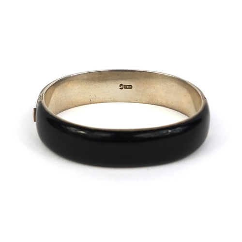 820 - French silver black enamel bangle impressed G.A.S makers mark and dogs head mark to the clasp, 6cm x... 