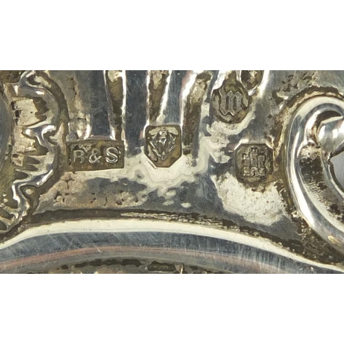 661 - Religious interest Scottish silver Holy water font embossed with religious figures, cherubs and a se... 