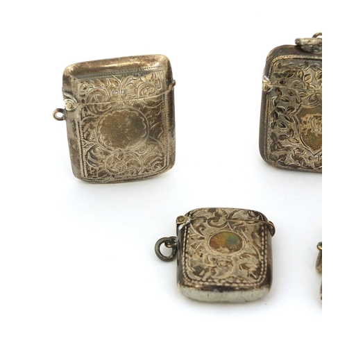 701 - Five silver vesta's with floral chased decoration, various hallmarks, the largest 5cm x 5cm, approxi... 