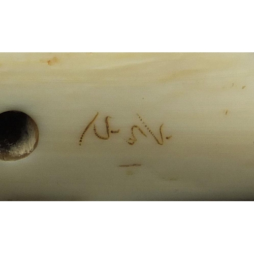 452 - Japanese carved ivory Netski in the form of an octopus on a Sperm Whale, character marks to the base... 